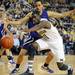 Michigan sophomore Tim Hardaway Jr. reaches for a loose ball as Northwestern junior Reggie Hearn early in the first quarter against Northwestern at Crisler Center on Wedensday. Melanie Maxwell I AnnArbor.com